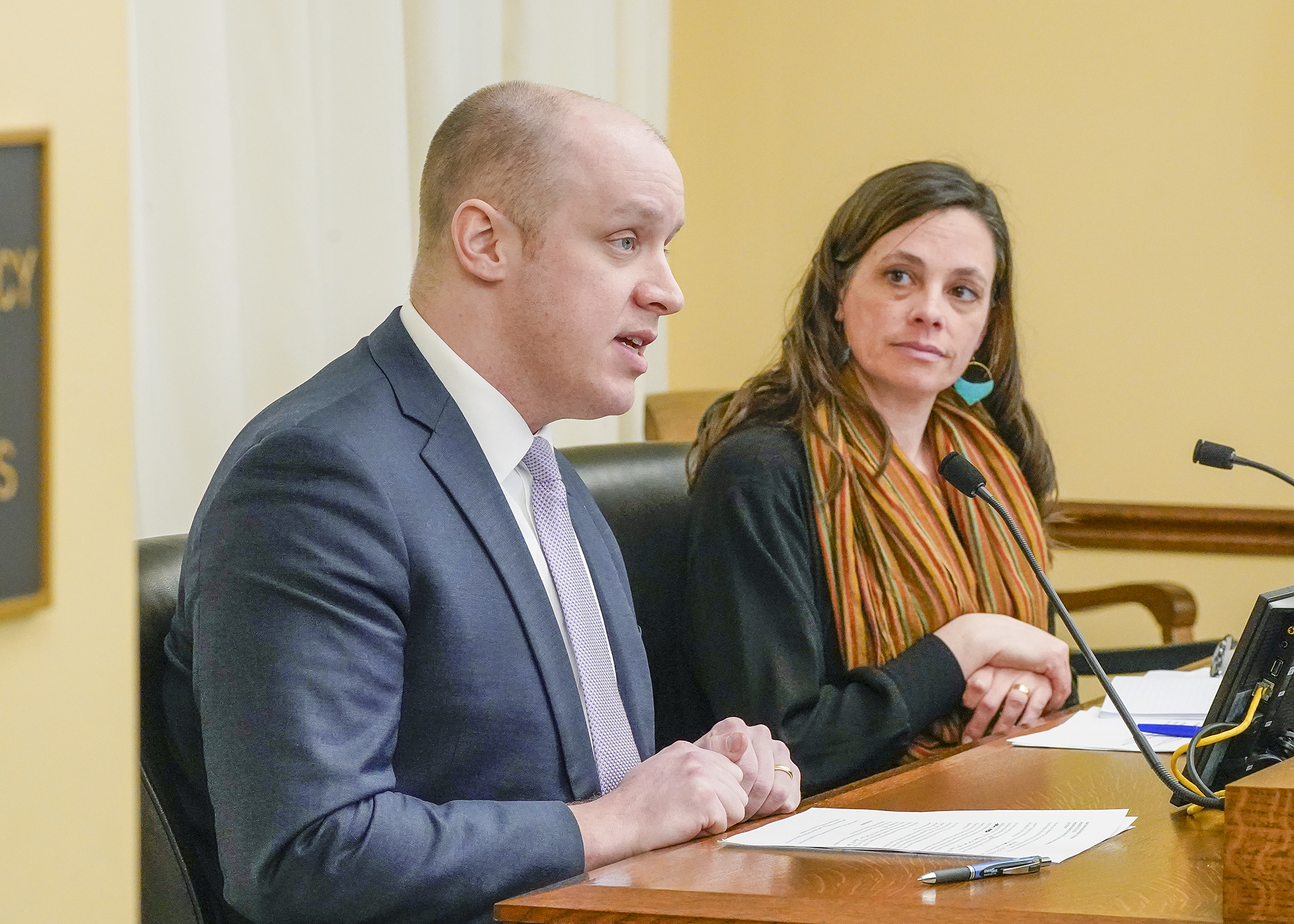 Nathan Zacharias, technology policy analyst for the Association of Minnesota Counties, testifies before the House Agriculture Finance and Policy Committee March 7 in support of a bill to modify a border-to-border broadband grant program. Rep. Kristi Pursell, right, is the sponsor. (Photo by Andrew VonBank)